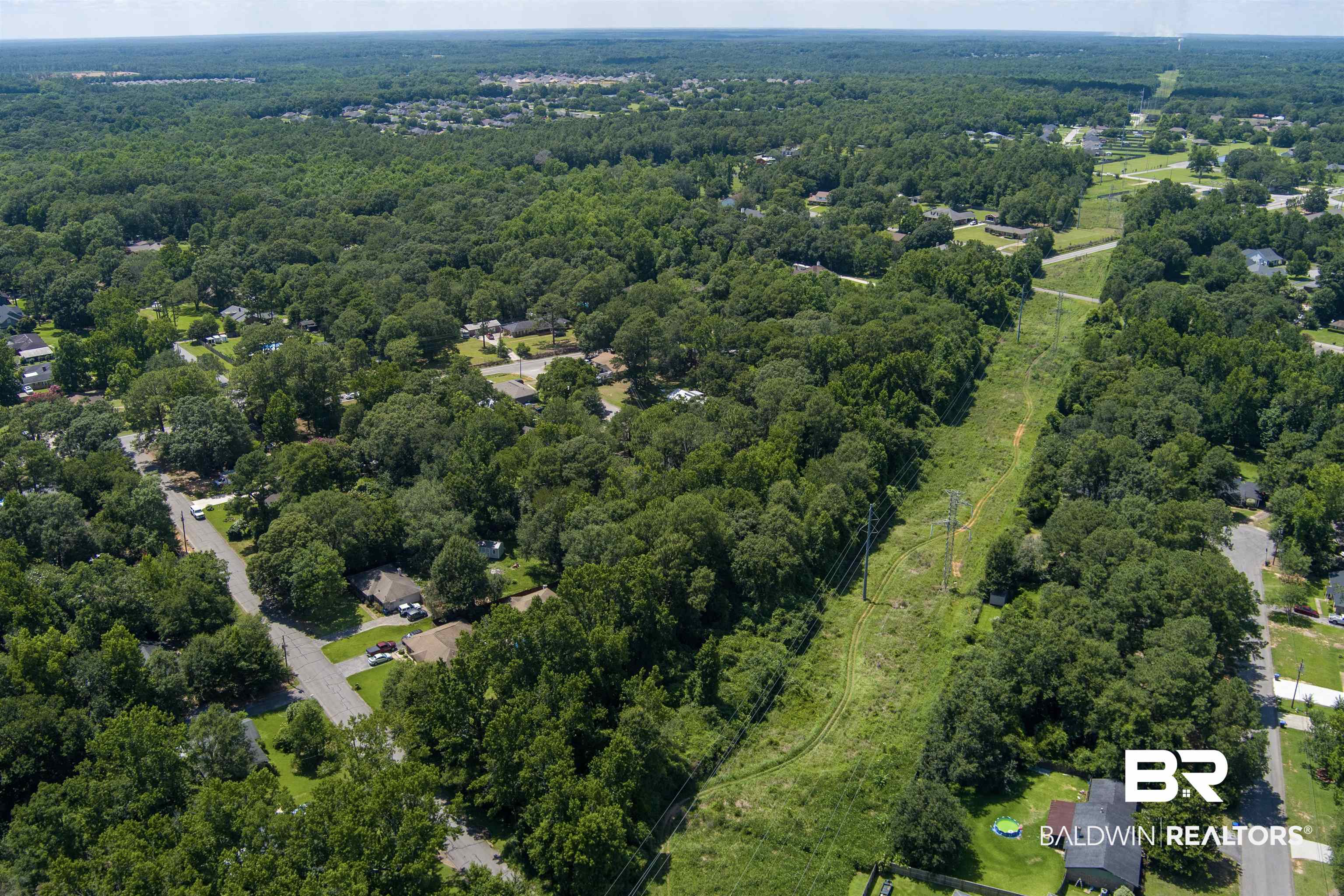 0 McFarland Road Mobile, AL 36695 - Photo 6 of 11 Aerial view of property's location featuring a heavily wooded area