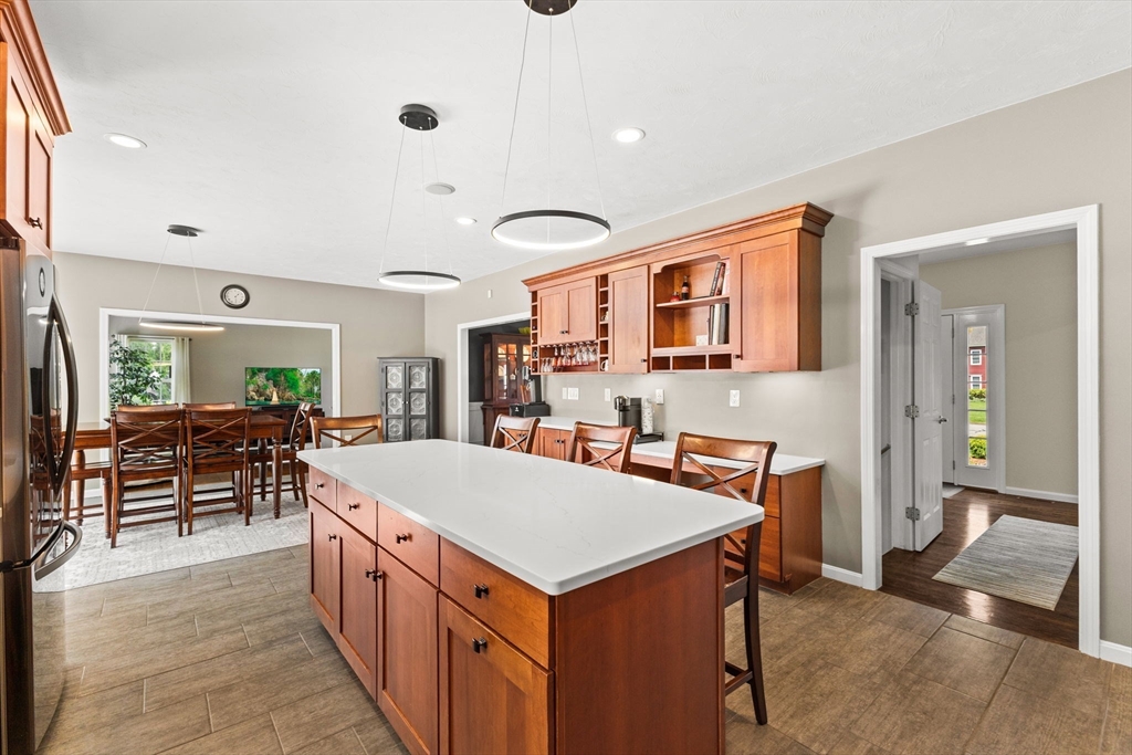20 Mohawk Road Raynham, MA 02767 - Photo 12 of 42 a living room with stainless steel appliances furniture a rug and a kitchen view