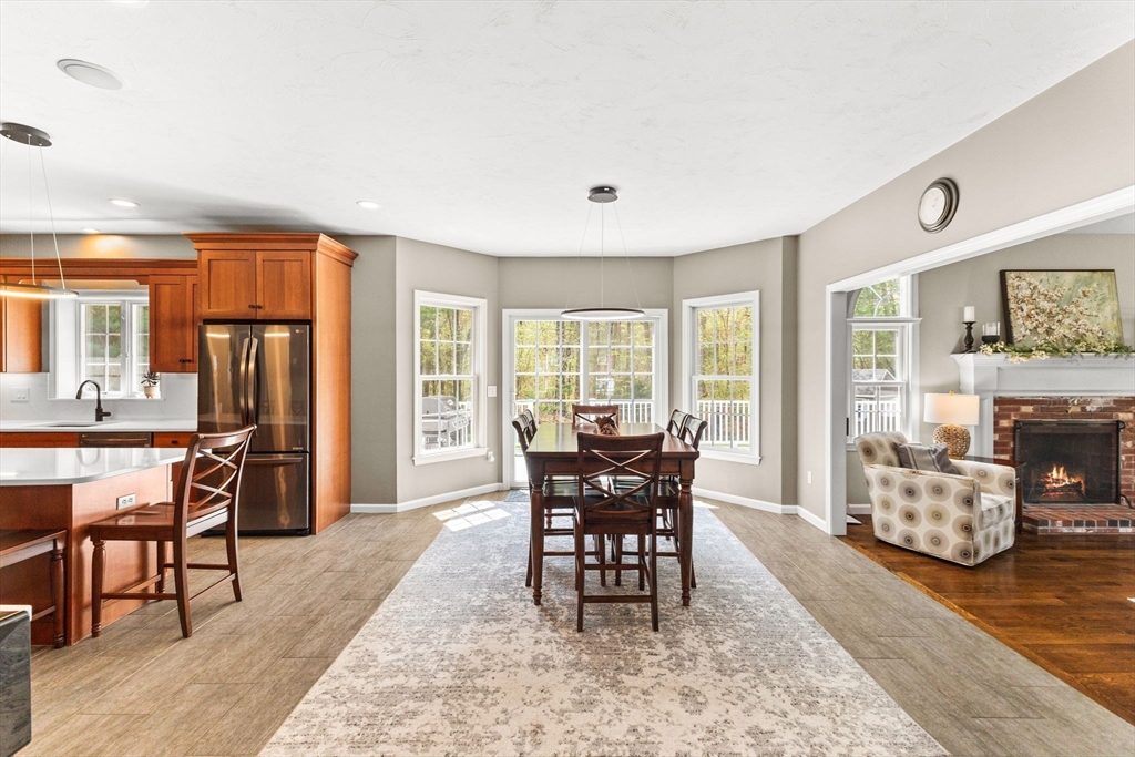 20 Mohawk Road Raynham, MA 02767 - Photo 15 of 42 a dining room with furniture a rug and wooden floor
