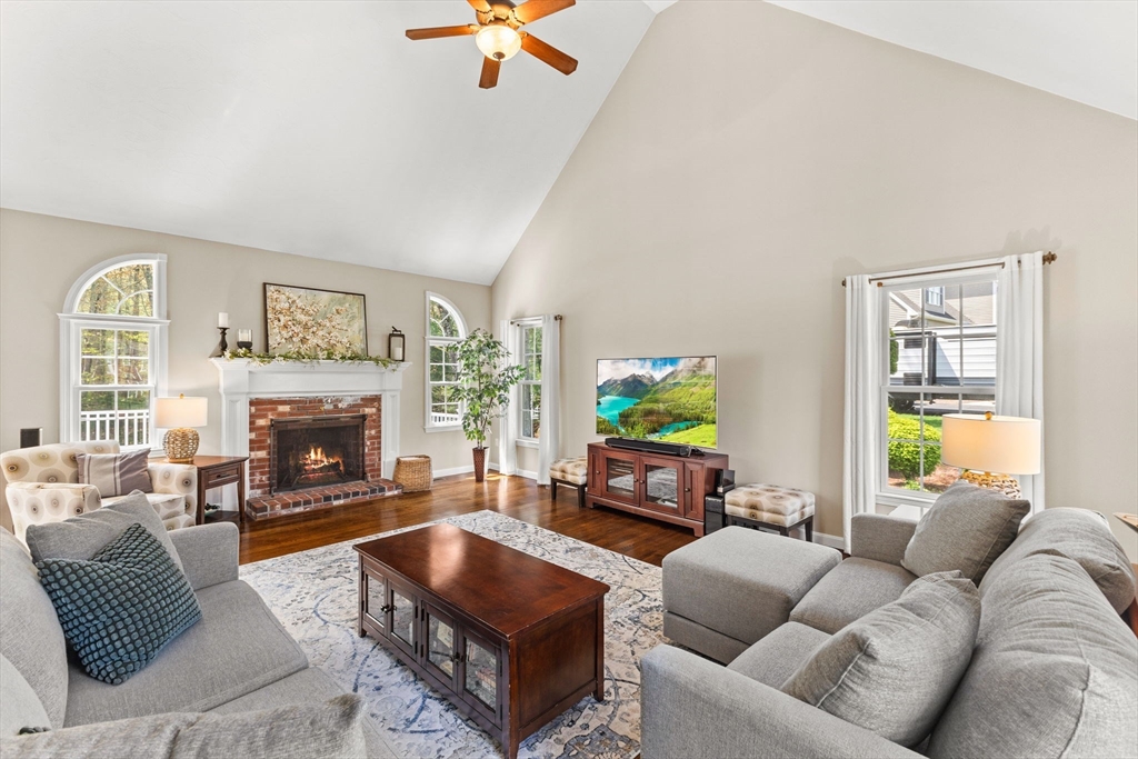 20 Mohawk Road Raynham, MA 02767 - Photo 18 of 42 a living room with furniture a fireplace and a flat screen tv