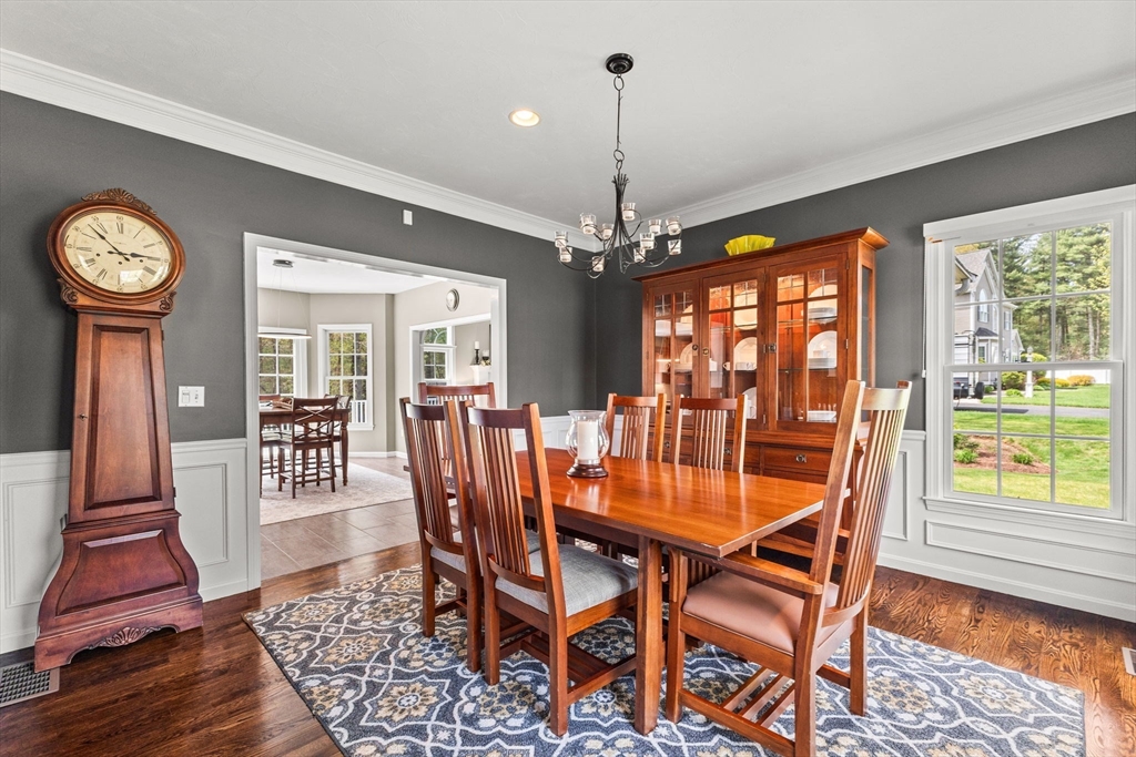 20 Mohawk Road Raynham, MA 02767 - Photo 20 of 42 a dining room with furniture a chandelier and wooden floor