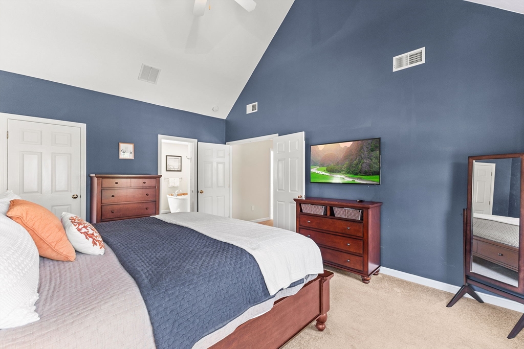 20 Mohawk Road Raynham, MA 02767 - Photo 29 of 42 a bedroom with a bed and a flat screen tv