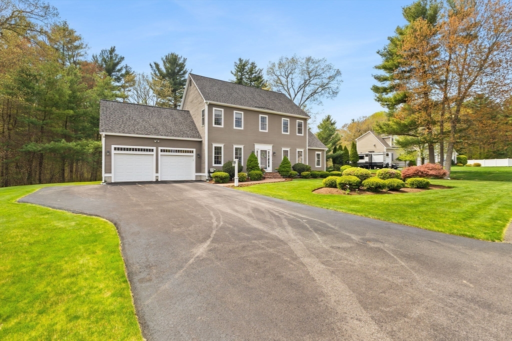 20 Mohawk Road Raynham, MA 02767 - Photo 3 of 42 a view of a house with a big yard and large trees