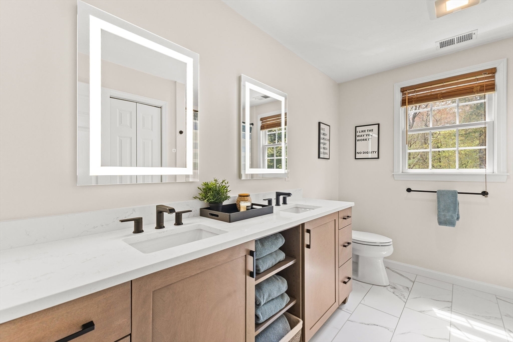 20 Mohawk Road Raynham, MA 02767 - Photo 33 of 42 a bathroom with a sink and a toilet