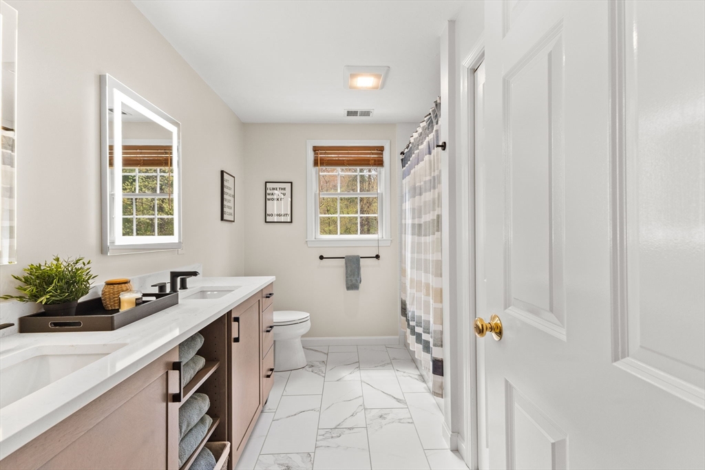 20 Mohawk Road Raynham, MA 02767 - Photo 34 of 42 a bathroom with a sink toilet and shower