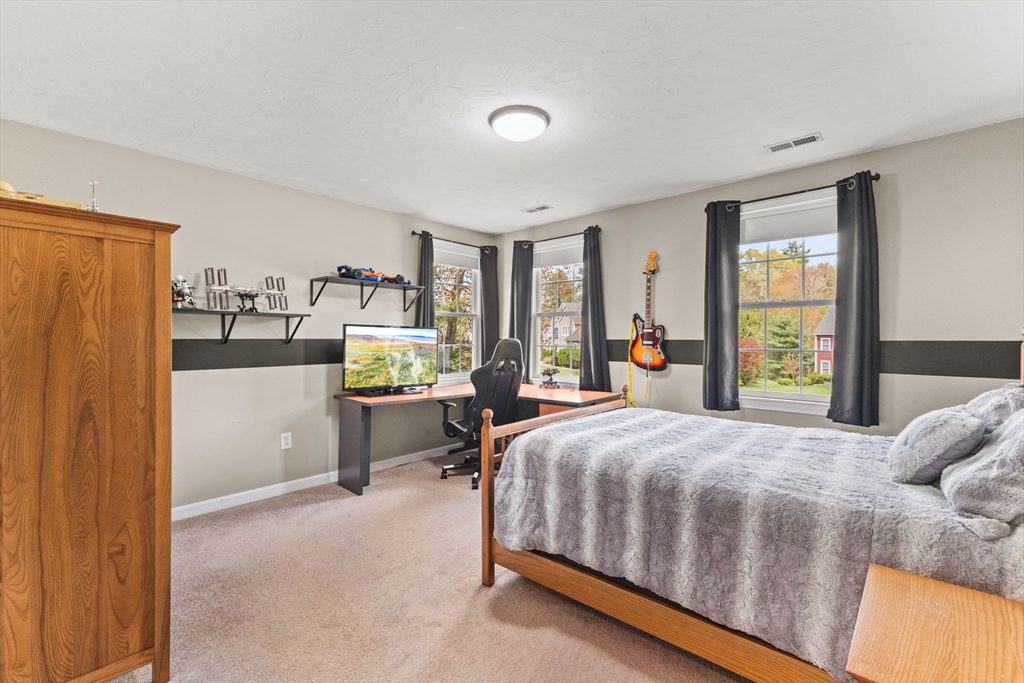 20 Mohawk Road Raynham, MA 02767 - Photo 35 of 42 a bedroom with a bed and large windows