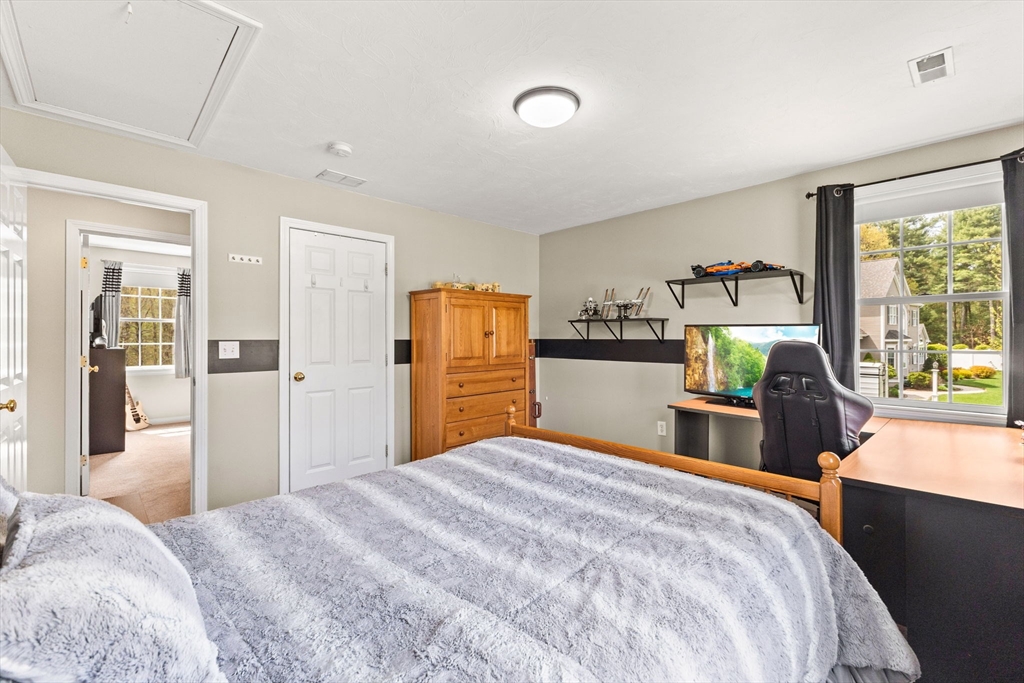 20 Mohawk Road Raynham, MA 02767 - Photo 36 of 42 a bedroom with a bed and wooden floor