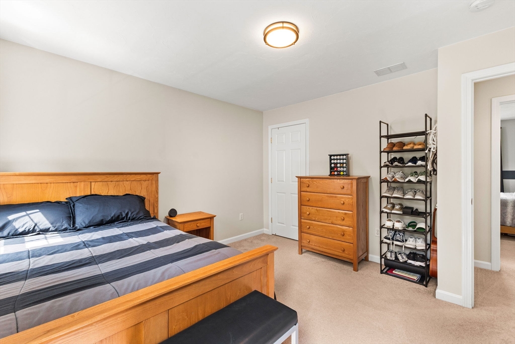 20 Mohawk Road Raynham, MA 02767 - Photo 38 of 42 a bedroom with a bed and a cabinets