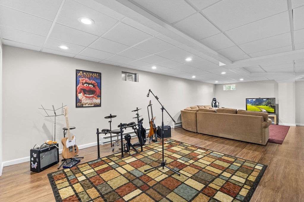 20 Mohawk Road Raynham, MA 02767 - Photo 41 of 42 a living room with furniture and a wooden floor