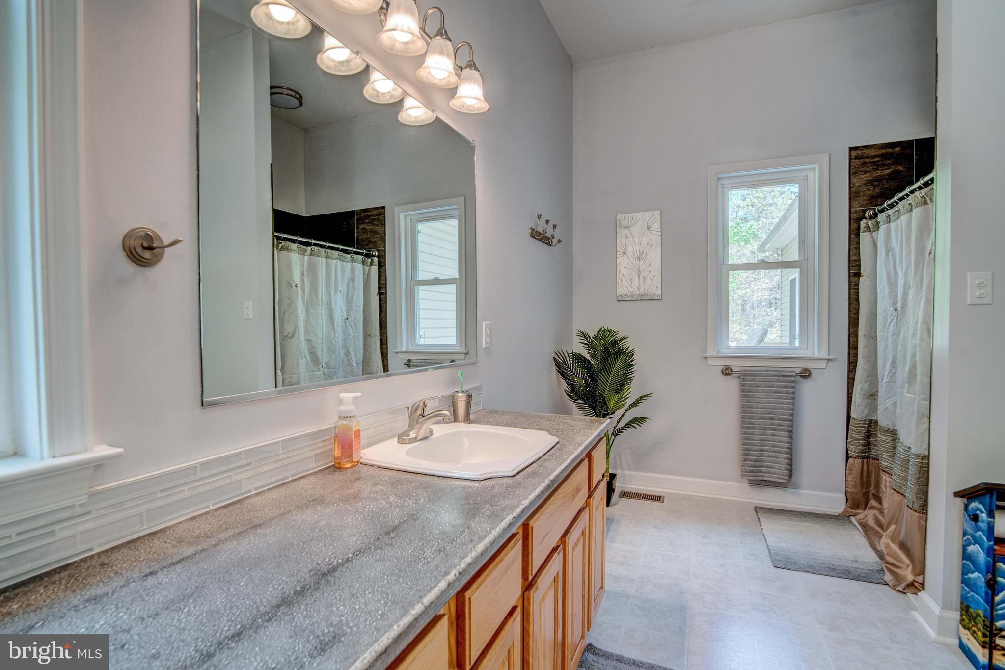 10605 H G Trueman Road Lusby, MD 20657 - Photo 40 of 56 Primary Bath