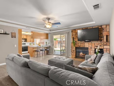 11191 Baker Lane Riverside, CA 92505 - Photo 12 of 49 a living room with fireplace furniture and a flat screen tv