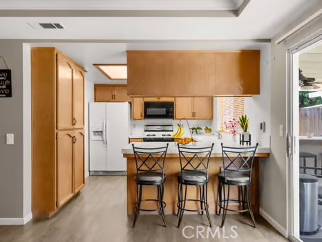 11191 Baker Lane Riverside, CA 92505 - Photo 14 of 49 a view of a dining room with furniture and a window