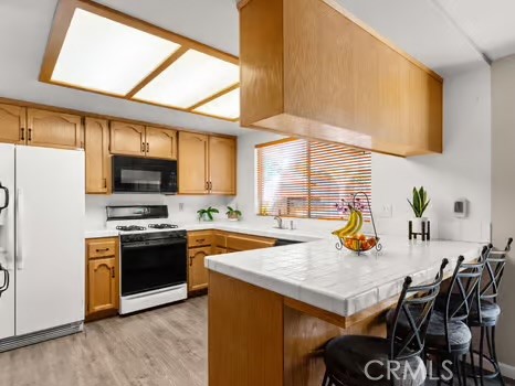 11191 Baker Lane Riverside, CA 92505 - Photo 16 of 49 a view of kitchen with sink and refrigerator