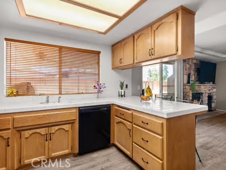 11191 Baker Lane Riverside, CA 92505 - Photo 17 of 49 a kitchen with sink cabinets and window