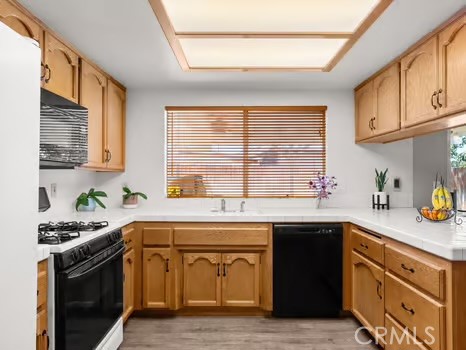 11191 Baker Lane Riverside, CA 92505 - Photo 18 of 49 a kitchen with stainless steel appliances granite countertop a sink stove and cabinets