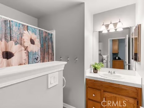 11191 Baker Lane Riverside, CA 92505 - Photo 21 of 49 a bathroom with a sink and a mirror