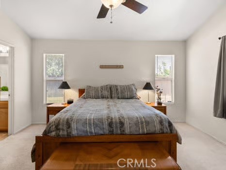 11191 Baker Lane Riverside, CA 92505 - Photo 23 of 49 a bedroom with a bed and window