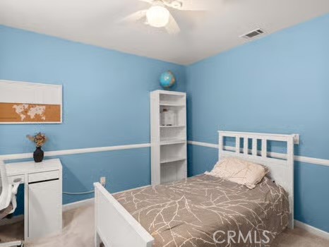 11191 Baker Lane Riverside, CA 92505 - Photo 27 of 49 a bedroom with a bed and a flat screen tv