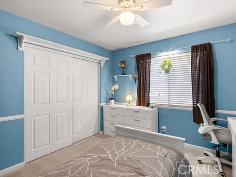 11191 Baker Lane Riverside, CA 92505 - Photo 28 of 49 a bedroom with a bed and a flat screen tv