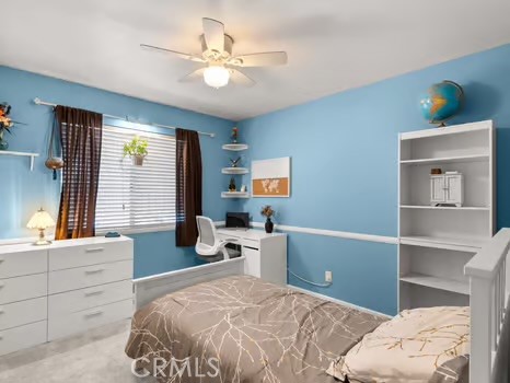 11191 Baker Lane Riverside, CA 92505 - Photo 29 of 49 a bedroom with a bed and a chandelier