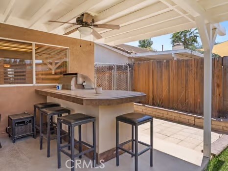 11191 Baker Lane Riverside, CA 92505 - Photo 34 of 49 a kitchen with a table and chairs in it