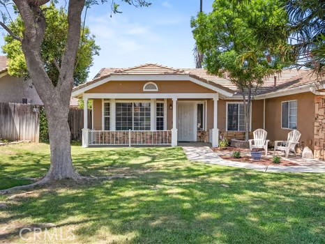 11191 Baker Lane Riverside, CA 92505 - Photo 5 of 49 a front view of a house with a garden and patio