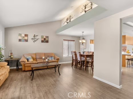 11191 Baker Lane Riverside, CA 92505 - Photo 6 of 49 a living room with furniture and a chandelier