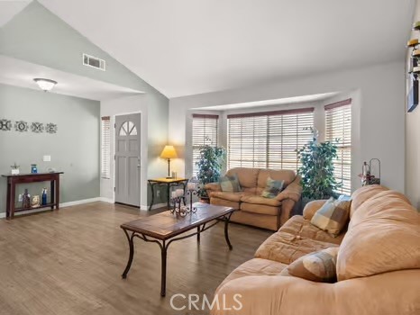11191 Baker Lane Riverside, CA 92505 - Photo 8 of 49 a living room with furniture and a fireplace