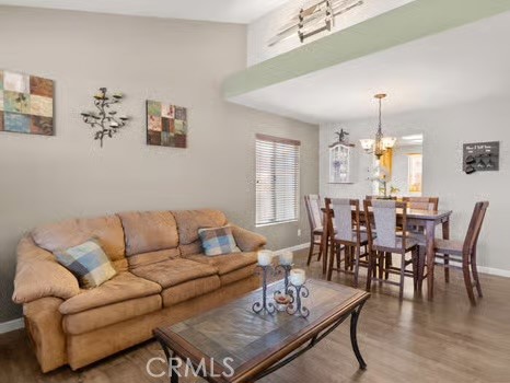 11191 Baker Lane Riverside, CA 92505 - Photo 9 of 49 a living room with furniture dining table and a chandelier