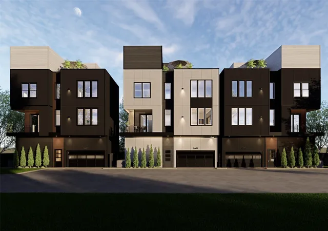 a view of a brick building next to a yard