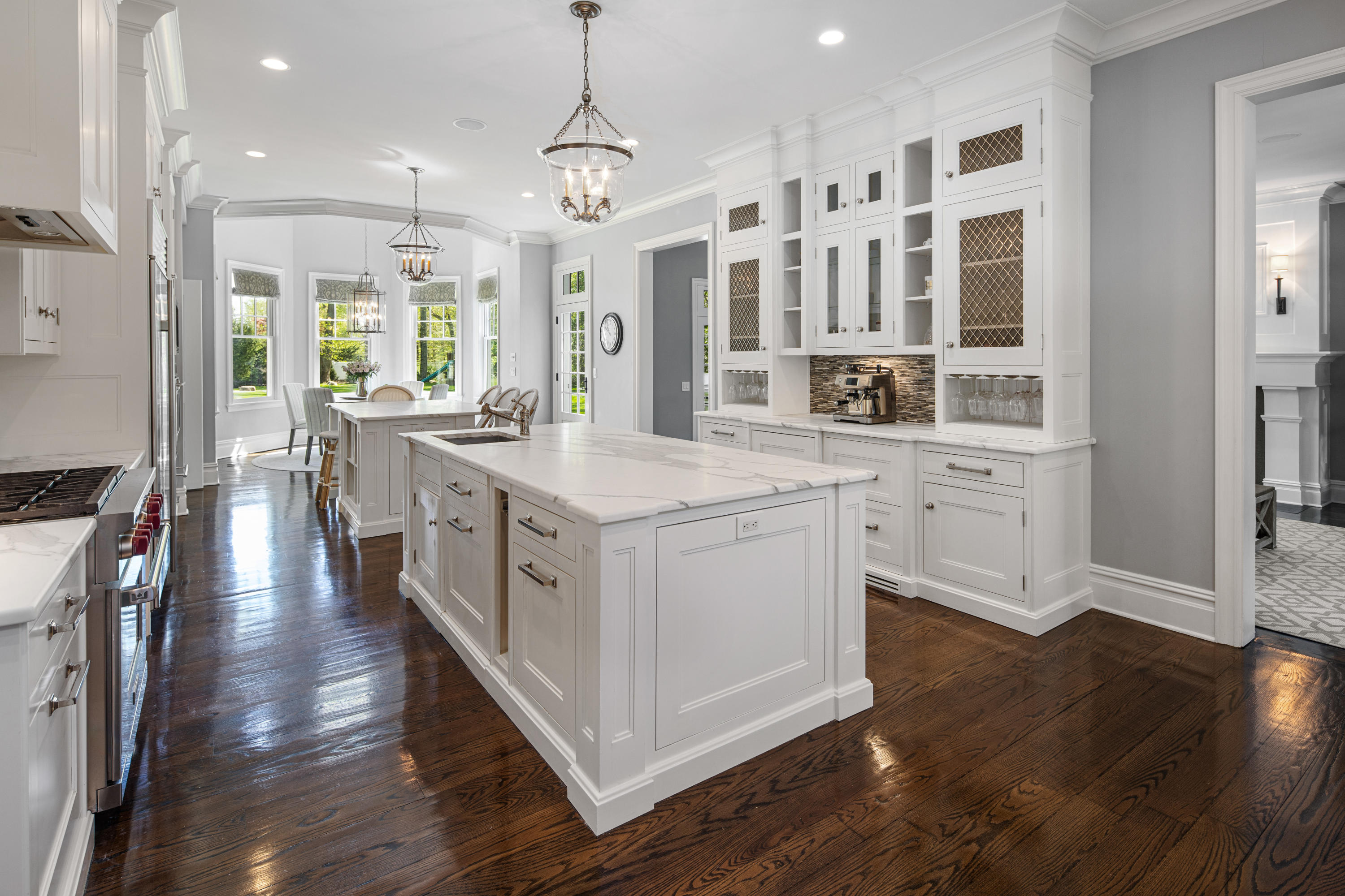 12 Shady Acres Road Darien, CT 06820 - Photo 13 of 47 a kitchen with stainless steel appliances granite countertop a white cabinets and wooden floor