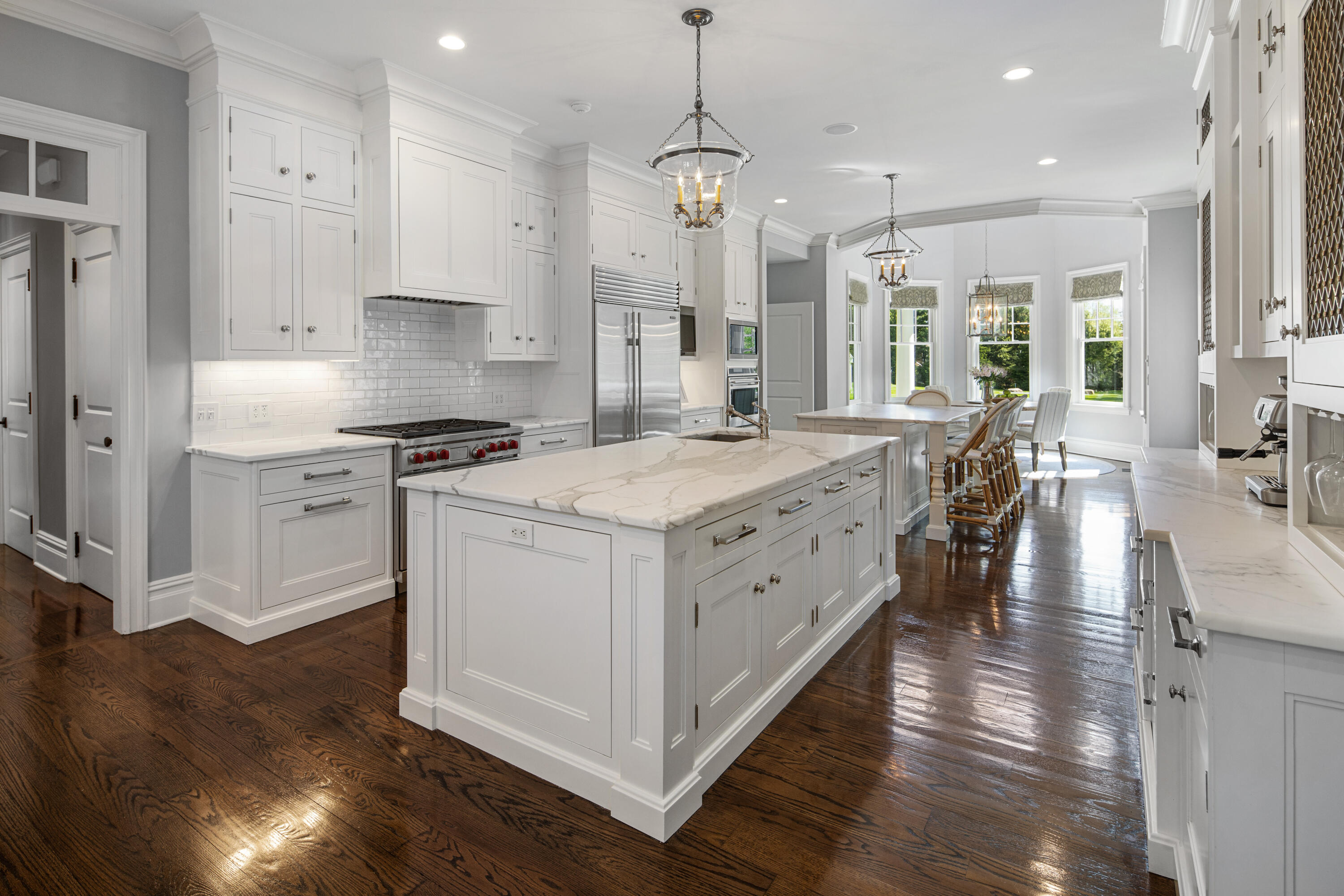 12 Shady Acres Road Darien, CT 06820 - Photo 14 of 47 a kitchen that has a lot of cabinets in it and wooden floors