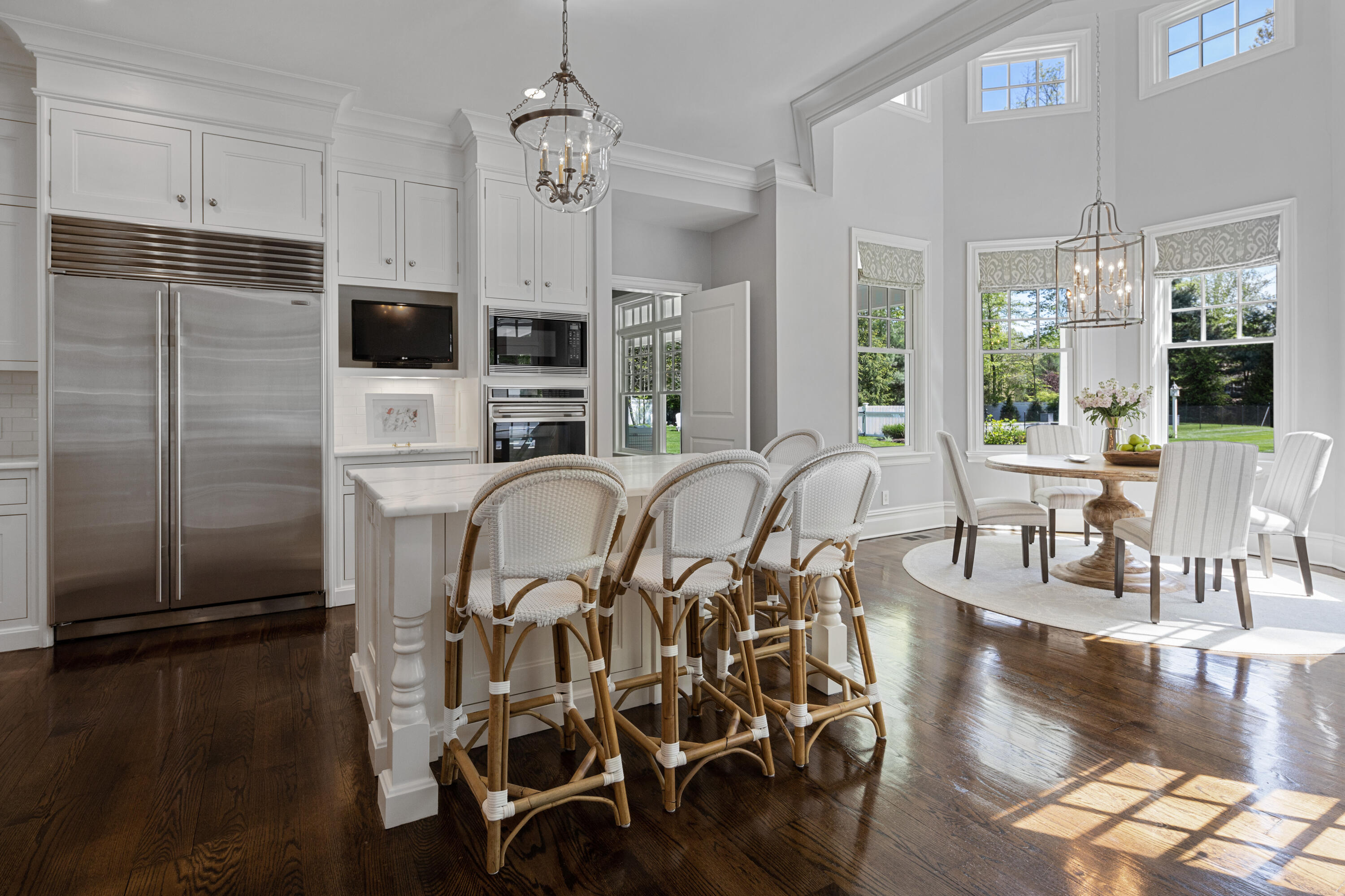 12 Shady Acres Road Darien, CT 06820 - Photo 17 of 47 a view of a dining room with furniture a chandelier and wooden floor