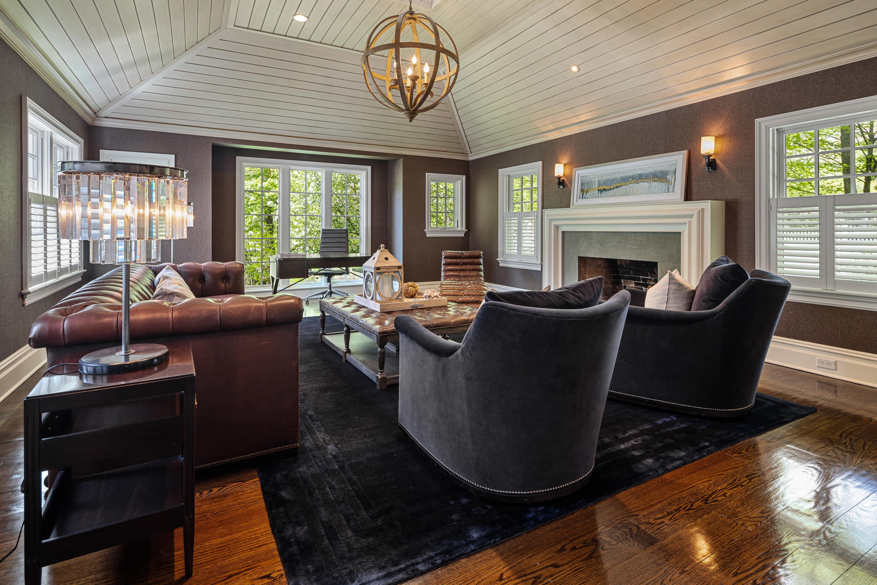 12 Shady Acres Road Darien, CT 06820 - Photo 19 of 47 a living room with furniture a fireplace and a chandelier