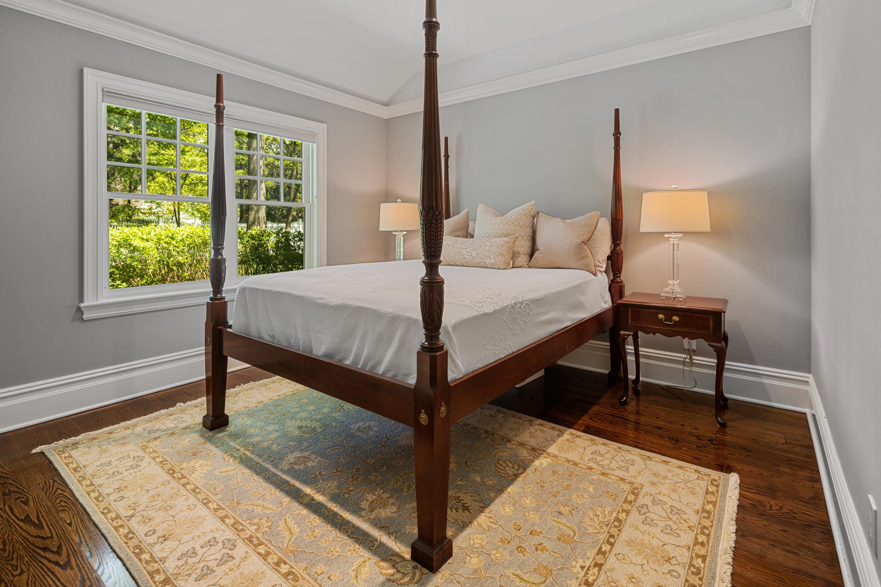 12 Shady Acres Road Darien, CT 06820 - Photo 22 of 47 a bed sitting in a bedroom next to a window