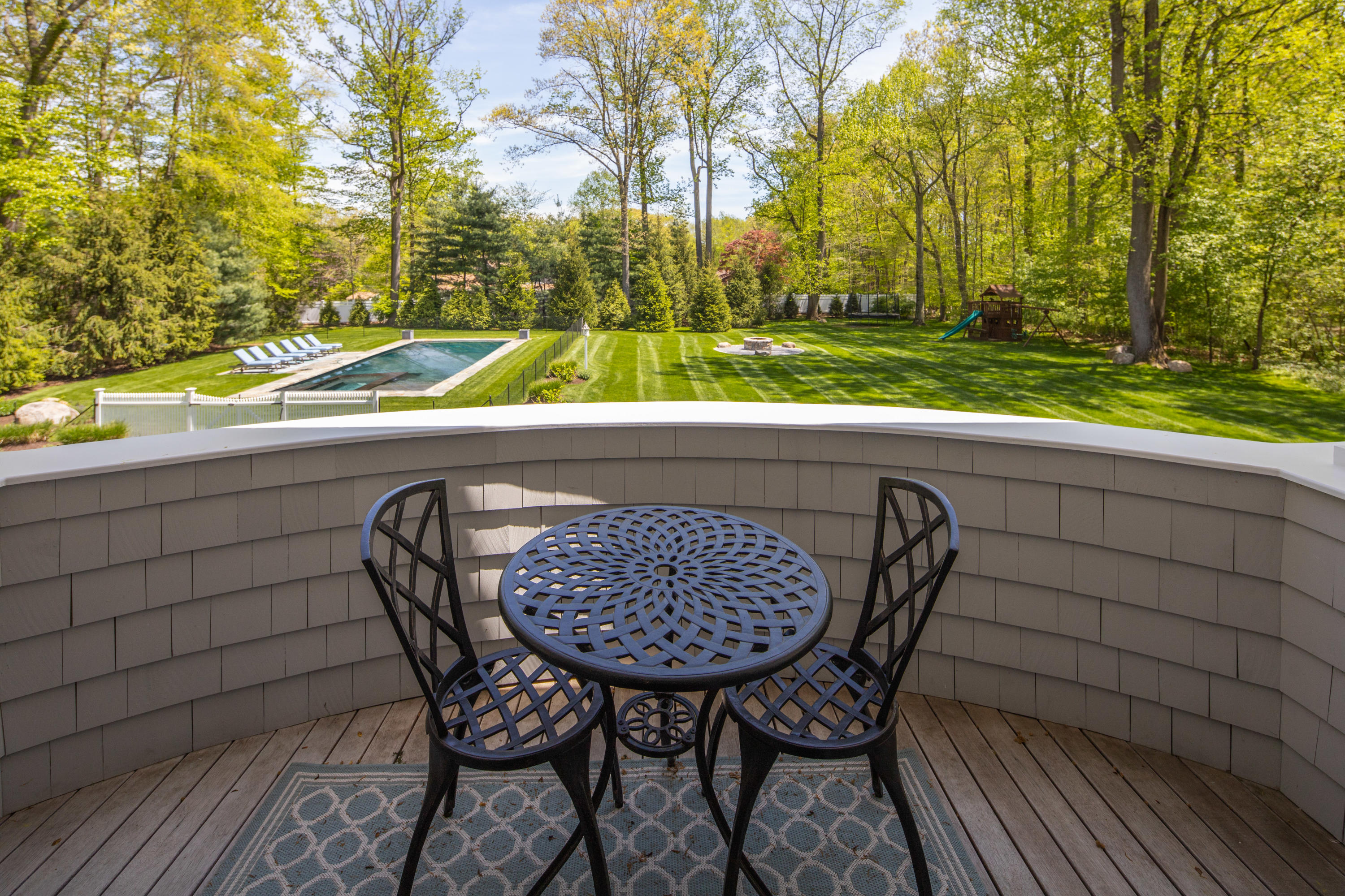 12 Shady Acres Road Darien, CT 06820 - Photo 26 of 47 a view of chairs and table in backyard