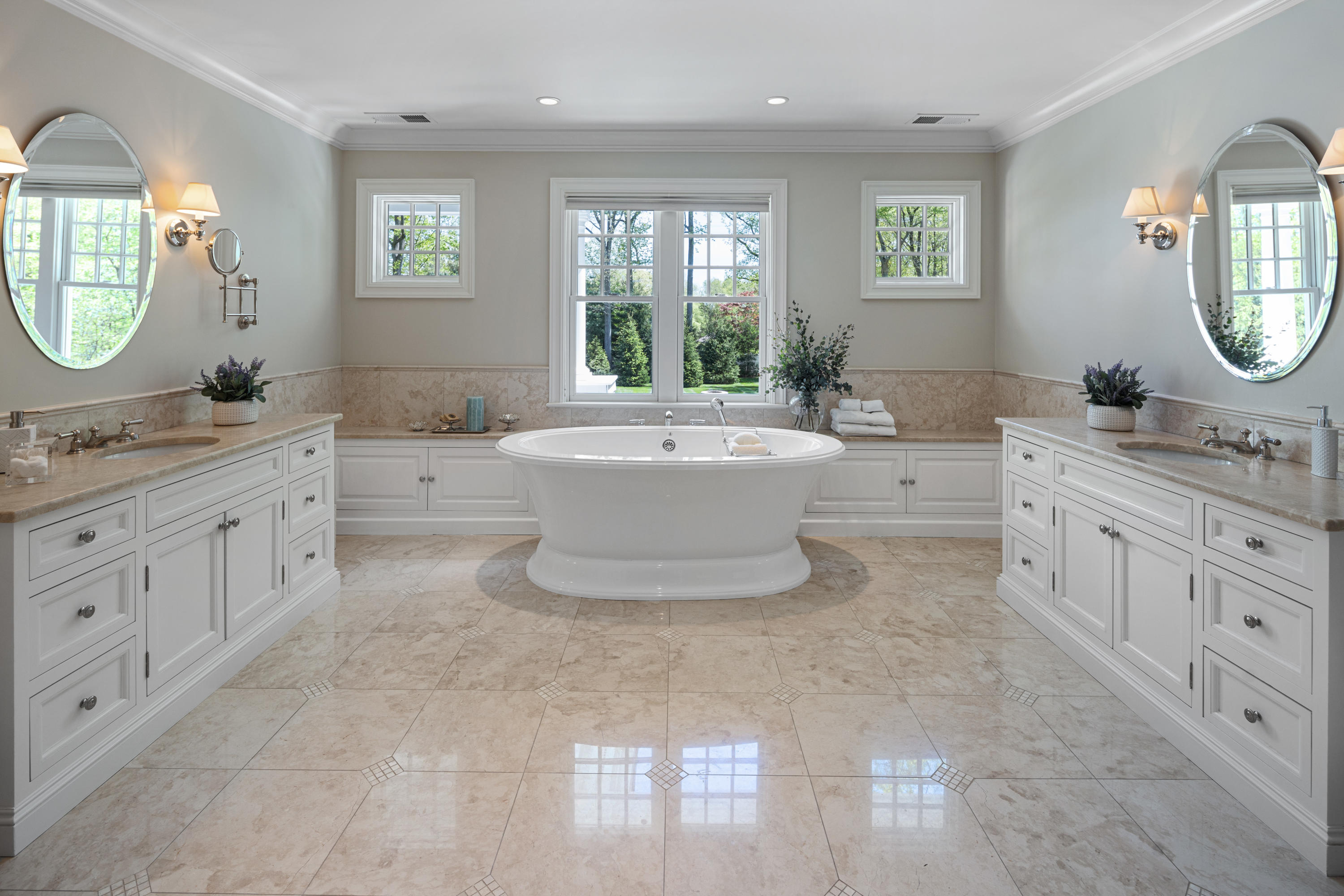 12 Shady Acres Road Darien, CT 06820 - Photo 27 of 47 a large bathroom with a double vanity sink a mirror a bathtub and a window