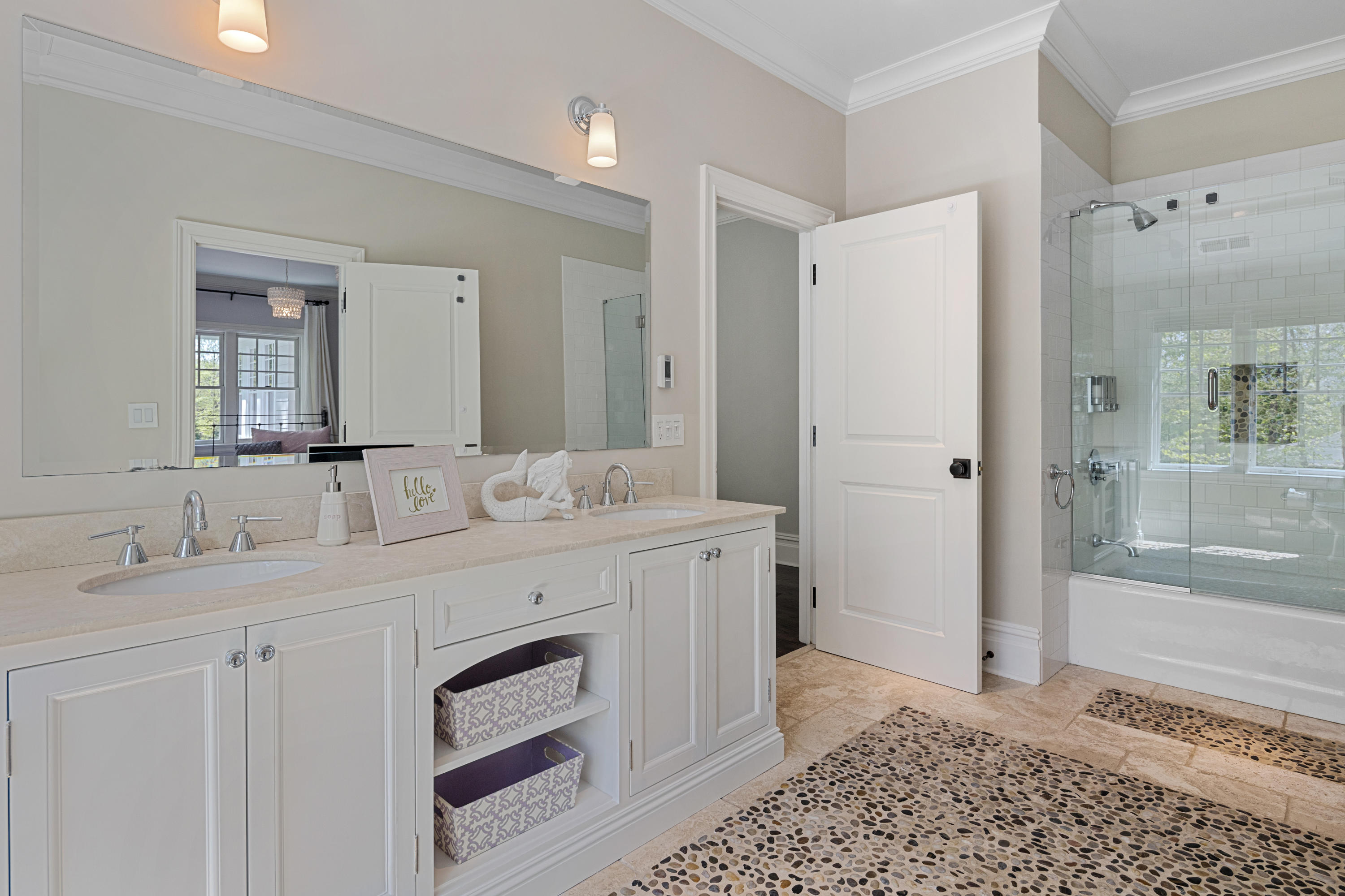 12 Shady Acres Road Darien, CT 06820 - Photo 33 of 47 a spacious bathroom with a granite countertop sink a mirror and a shower