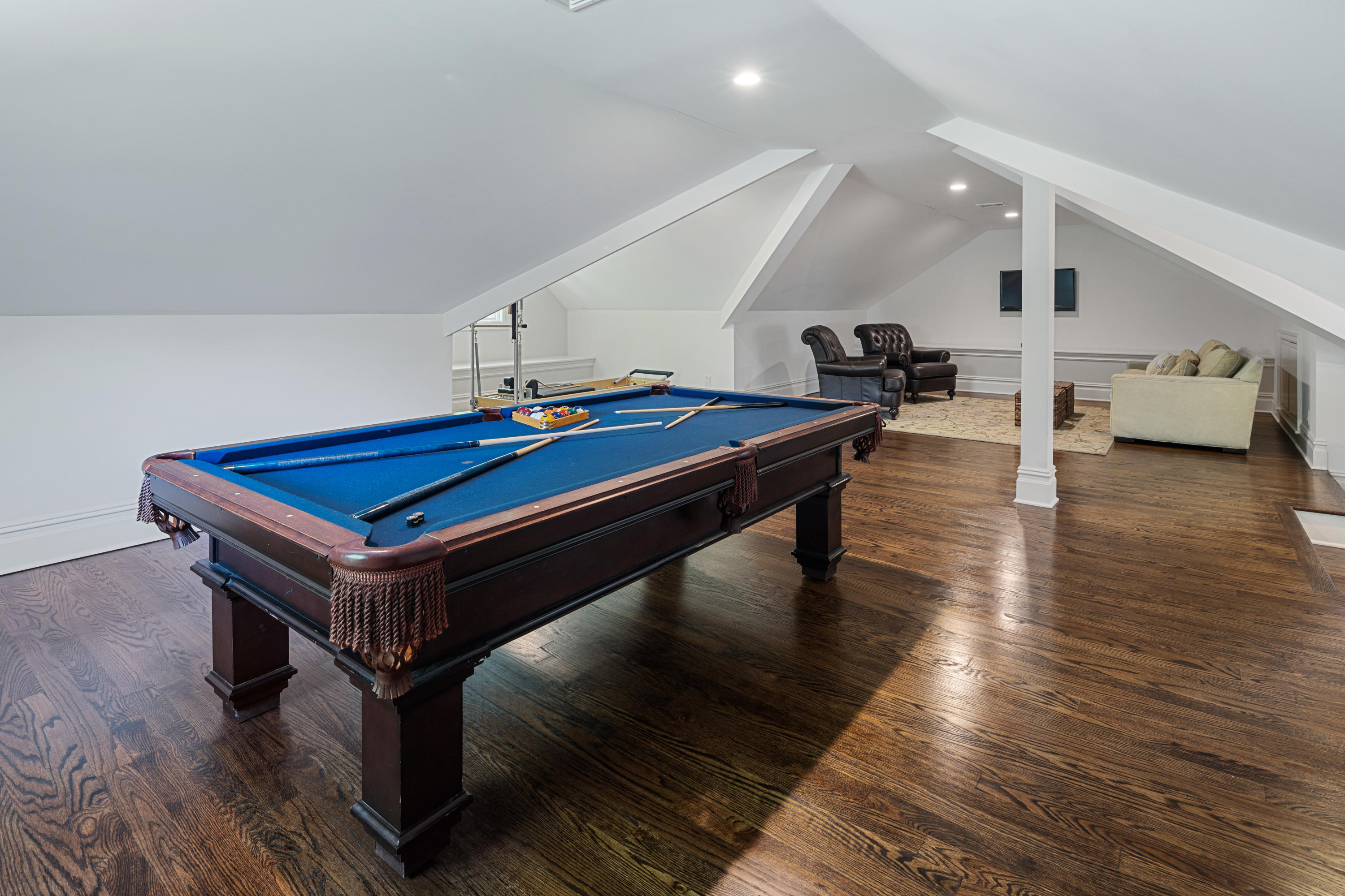 12 Shady Acres Road Darien, CT 06820 - Photo 38 of 47 a room with wooden floor pool table and chairs
