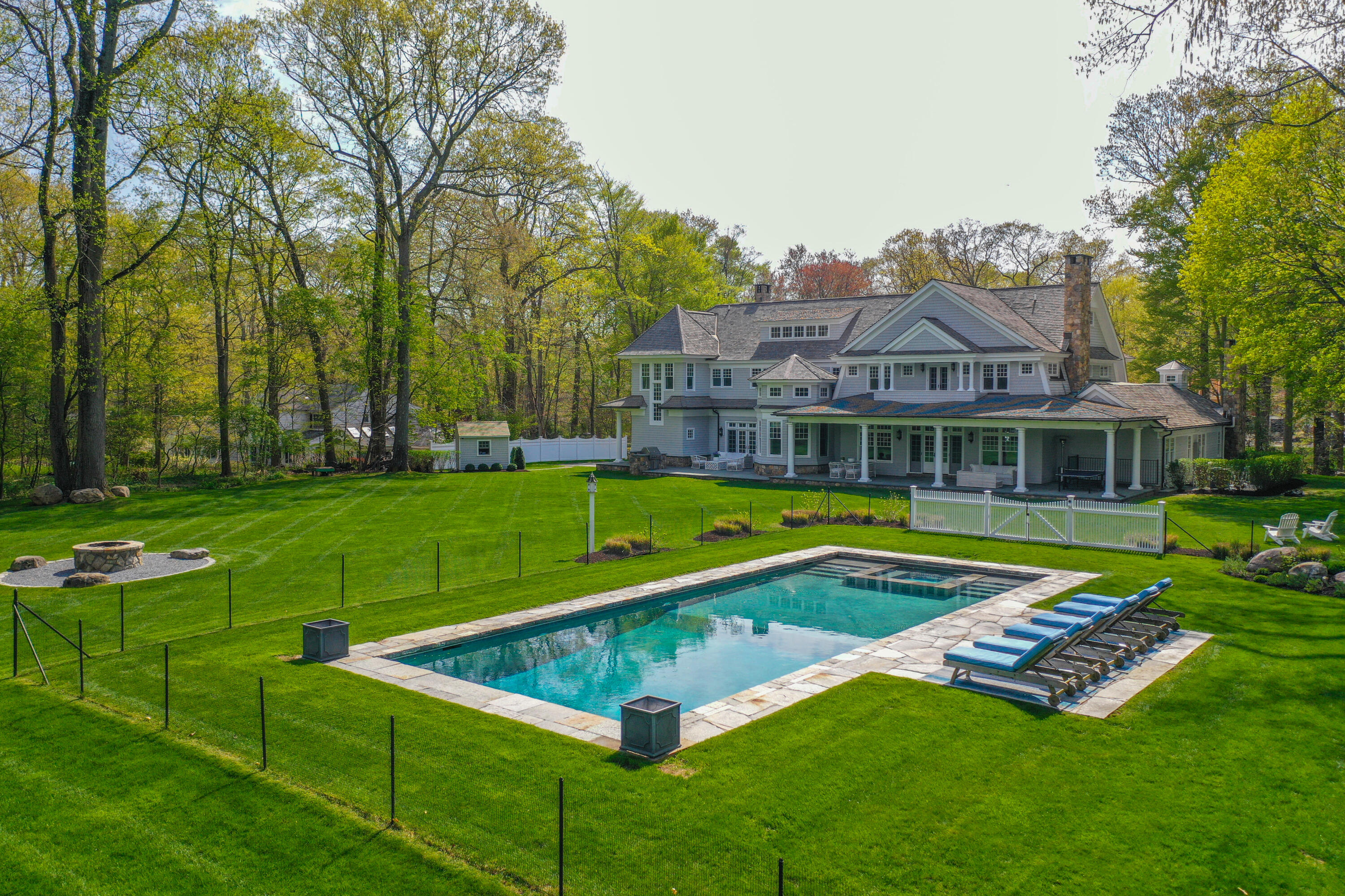 12 Shady Acres Road Darien, CT 06820 - Photo 43 of 47 a view of a house with swimming pool and yard