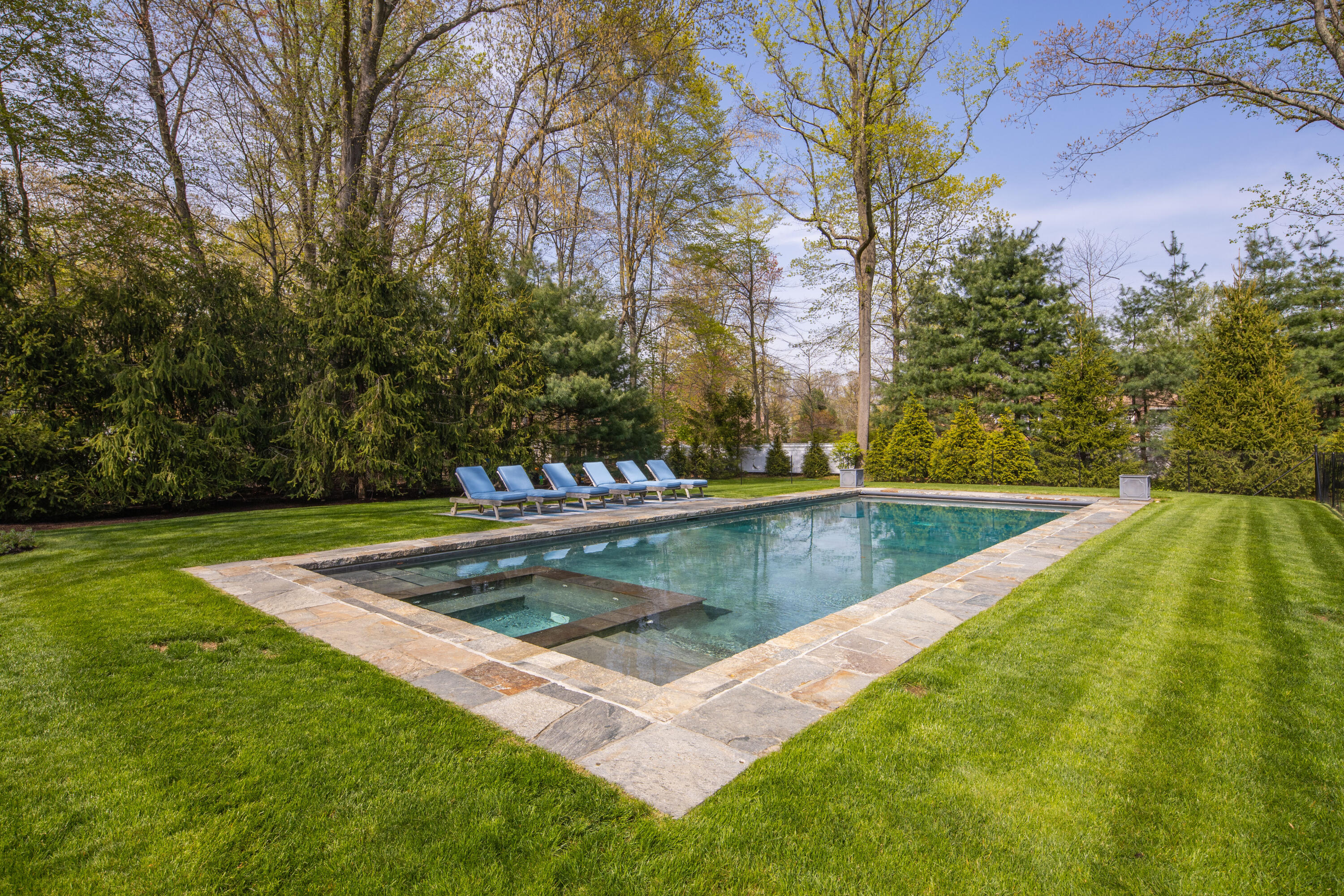 12 Shady Acres Road Darien, CT 06820 - Photo 44 of 47 a view of a backyard with swimming pool