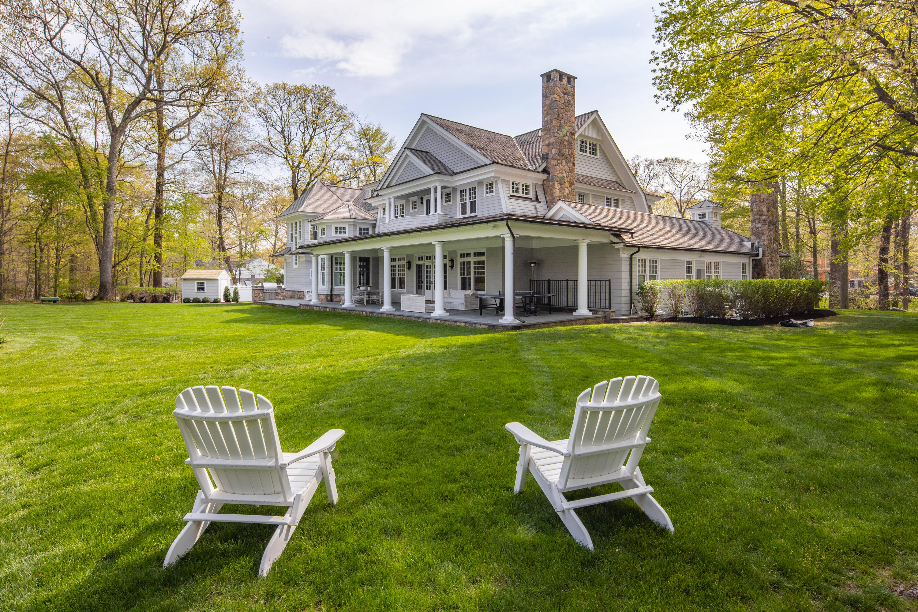 12 Shady Acres Road Darien, CT 06820 - Photo 46 of 47 a view of a chairs in backyard of house