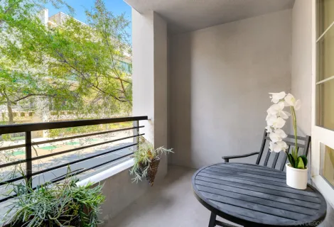 a view of a dining room with furniture and a potted plant