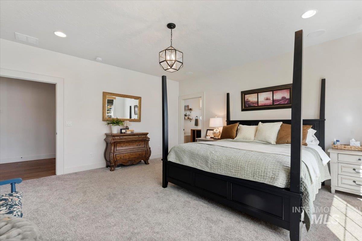 15164 Pinehurst Way Caldwell, ID 83607 - Photo 22 of 50 Spacious bedroom featuring plush gray carpeting and recessed lighting
