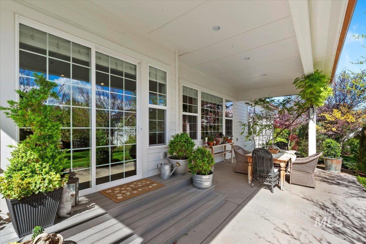 15164 Pinehurst Way Caldwell, ID 83607 - Photo 38 of 50 Covered porch featuring a wood-finish floor and white paneled ceiling