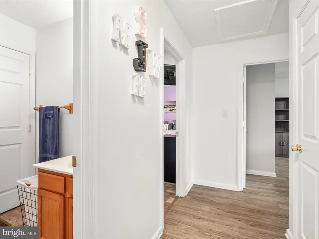 a bedroom with a bed and a table with potted plant