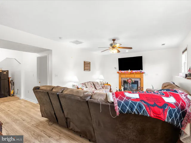 a view of room with wooden floor and cabinet