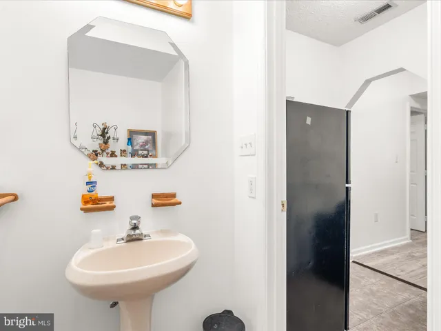 a view of a swimming pool with an outdoor space and seating area