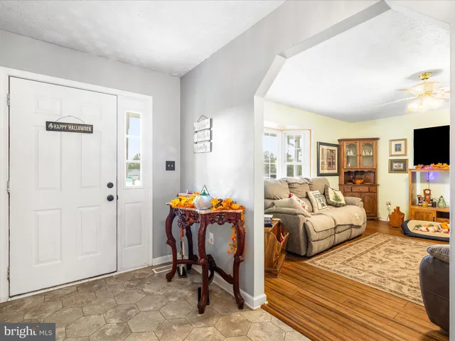 a view of a livingroom with furniture and a flat screen tv