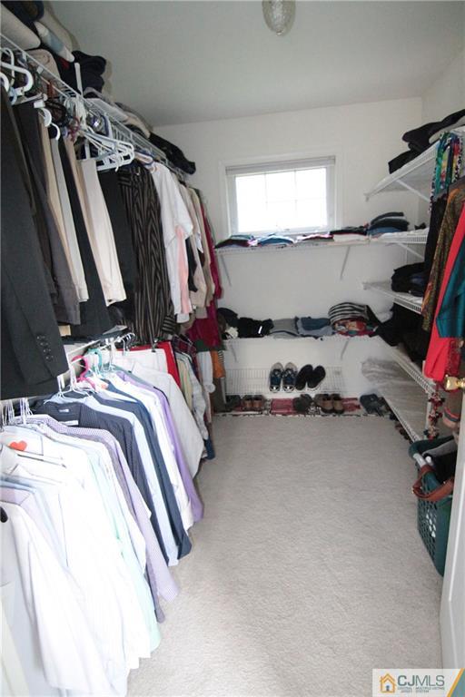 15 Gramercy Road Monmouth Junction, NJ 08852 - Photo 13 of 17 a view of walk in closet with clothes and shoes